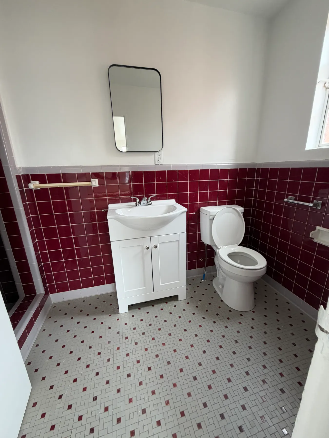 Updated bathroom with tile and vanity