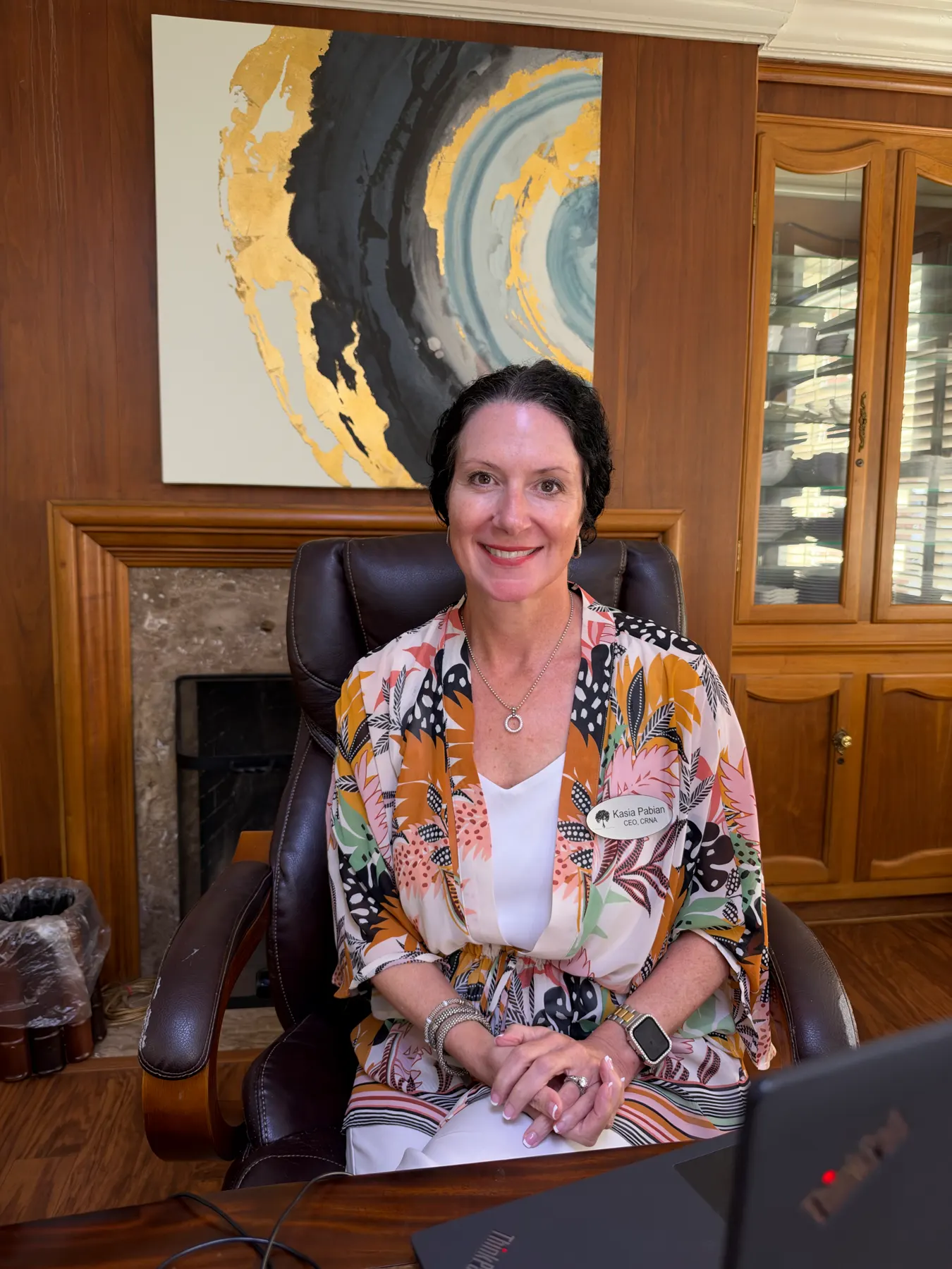 Kasha Pabian seated at her desk