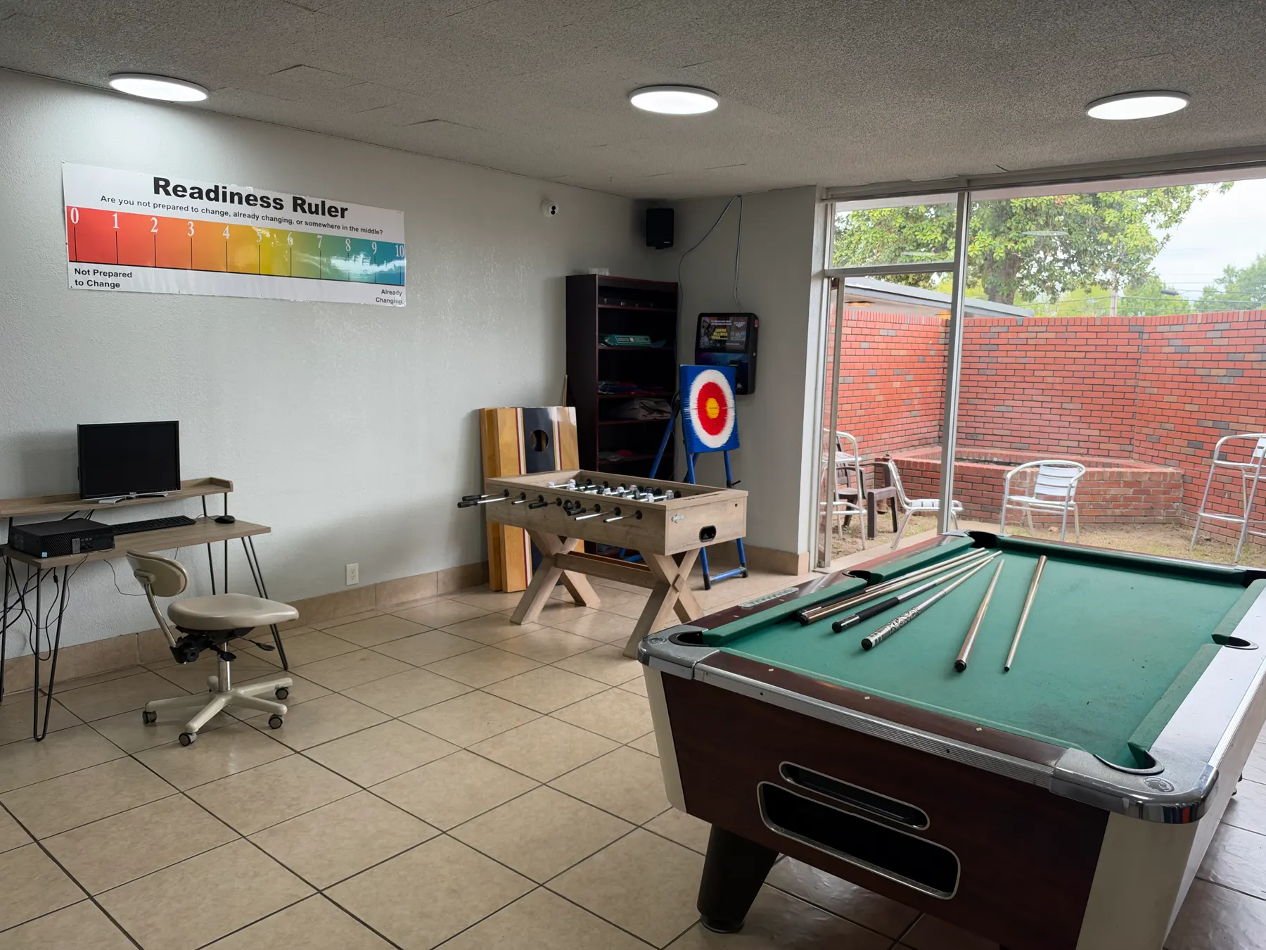 Recreation room with pool table, arcade game and computer stations