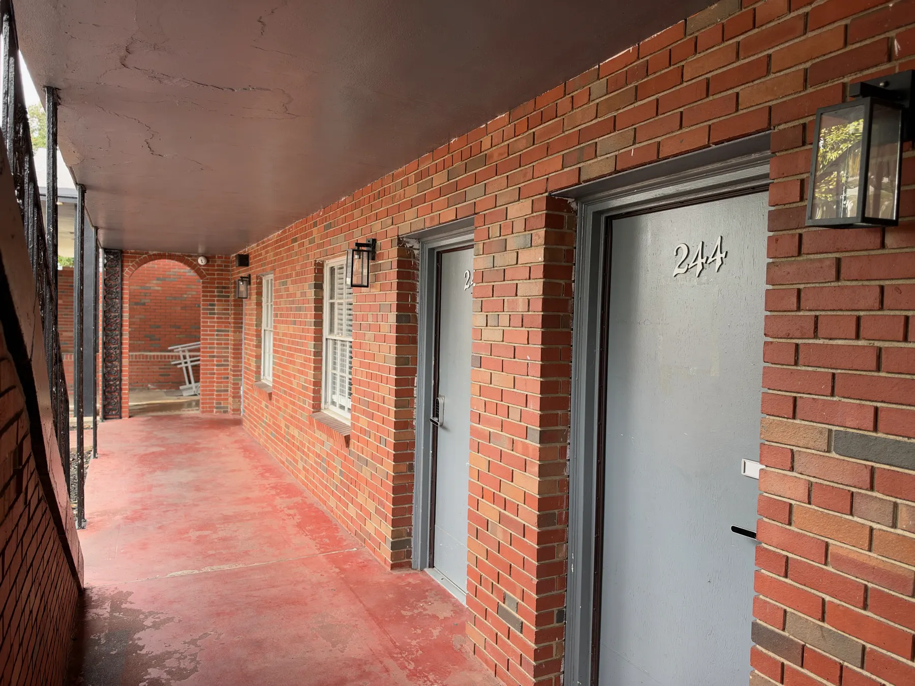 Covered brick walkway outside residence rooms